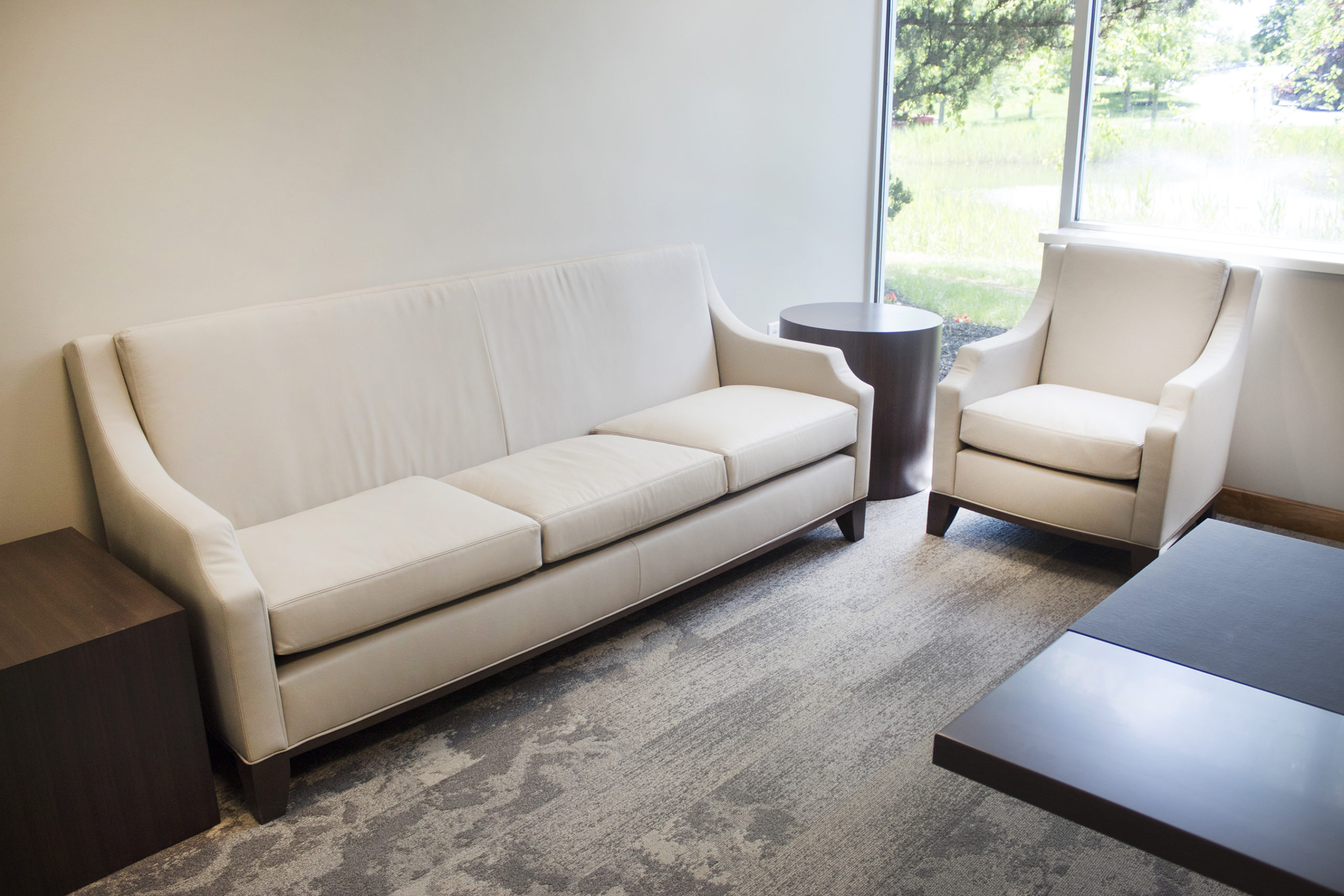 Executive Office with White and Brown Workstation Sofa and Chair