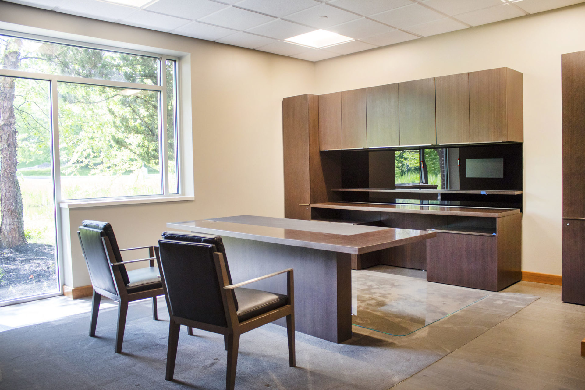 private office with desk storage and seating