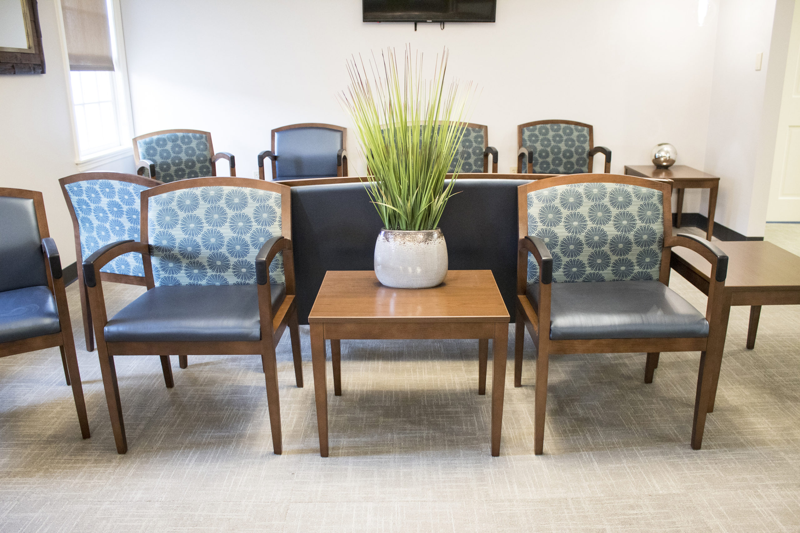 Two Chairs and Table in Waiting Room